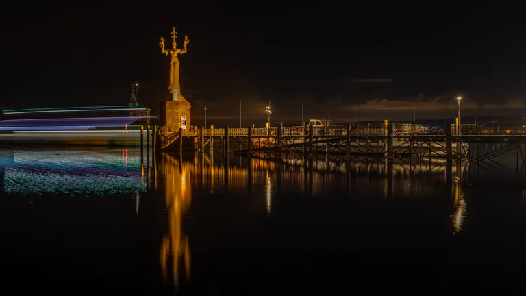 Night shot with illuminated sculpture Imperia