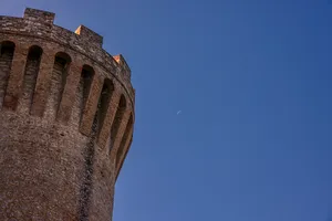 Stone tower with delicate moon